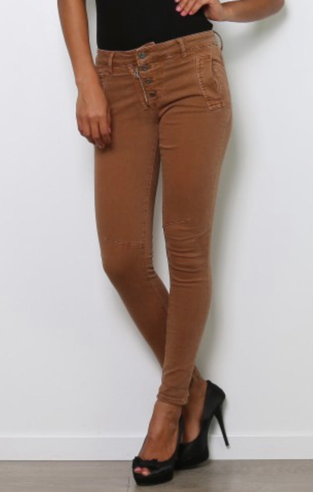 Model wearing camel brown melly jeans and heels