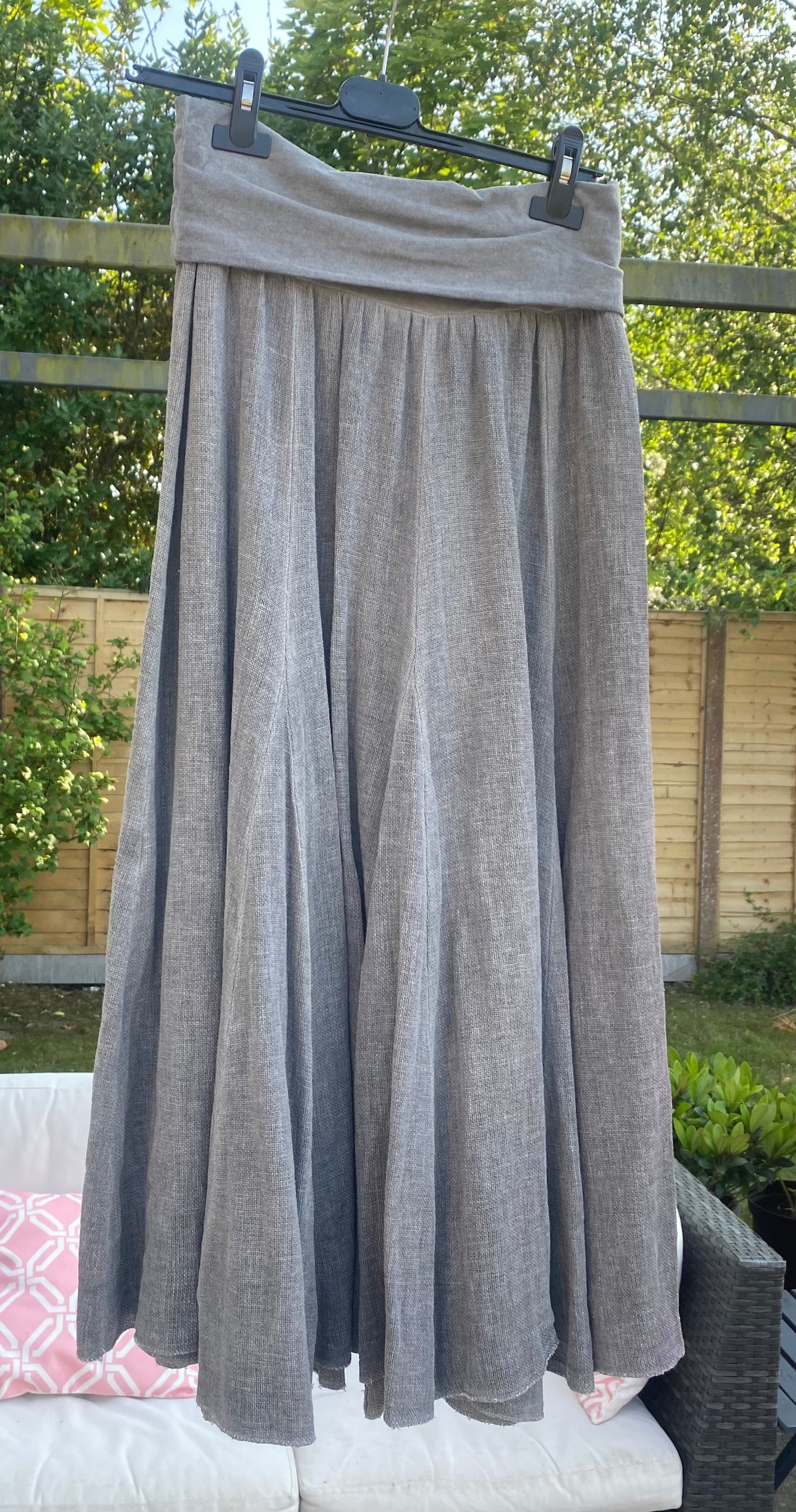 Light grey linen sugarbabe maxi skirt hanging up outside 