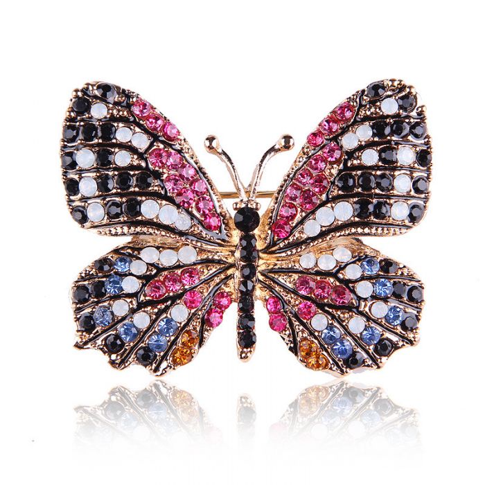 Butterfly brooch in gold with black and fuchsia crystals 
