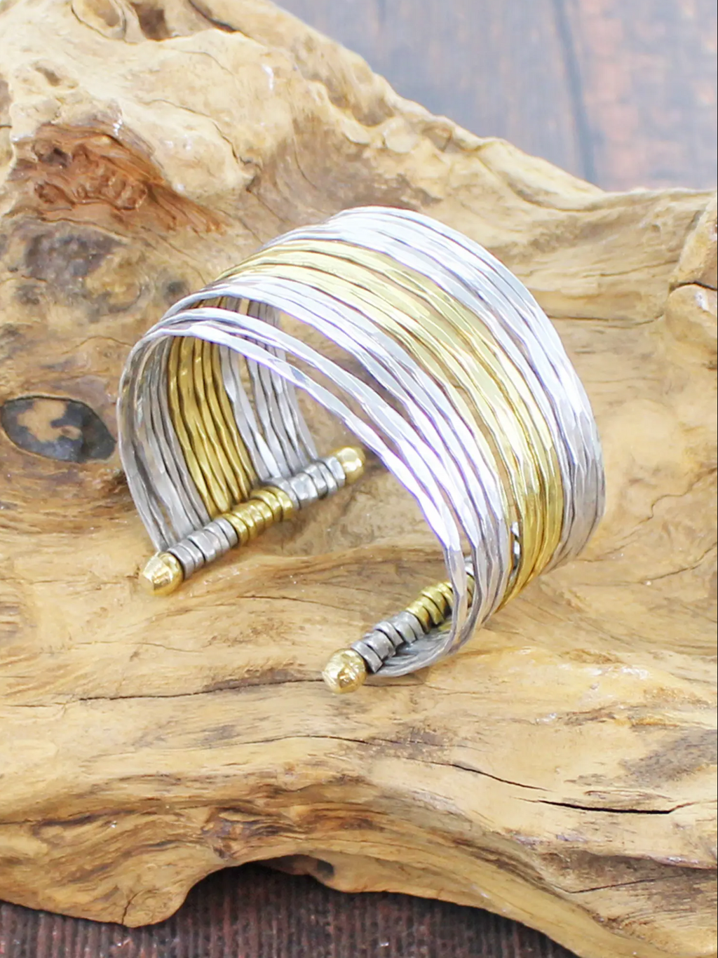 photo of multistrand cuff in silver and gold on bronze 