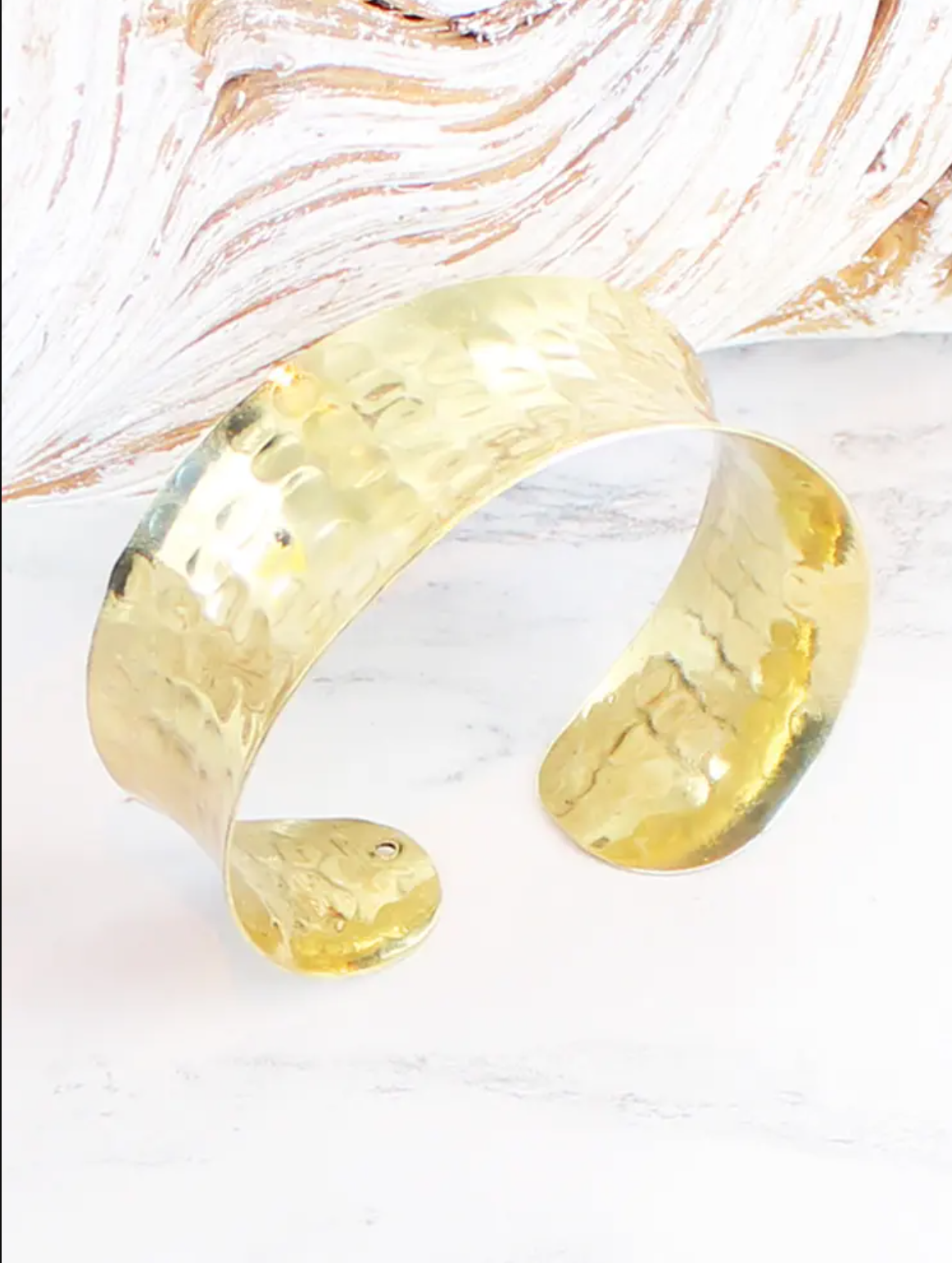 photo of beaten metal solid cuff in gold plated bronze