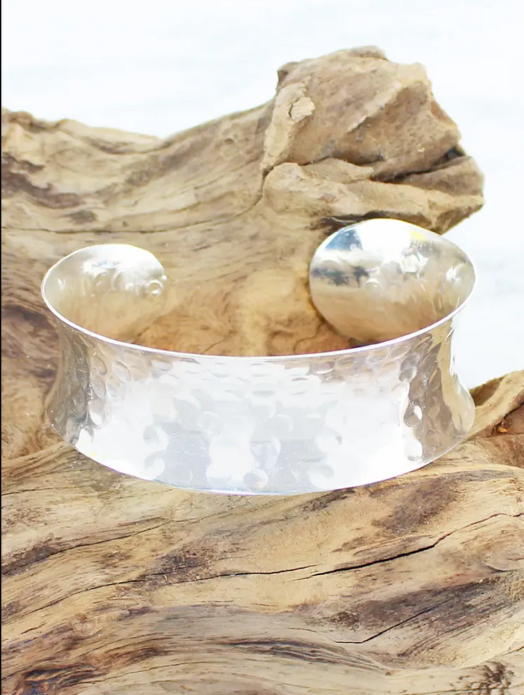 photo of solid cuff in beaten silver on bronze