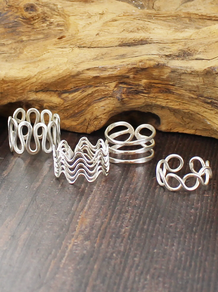 photo of silver plated set of four adjustable rings in various woven multi strand details