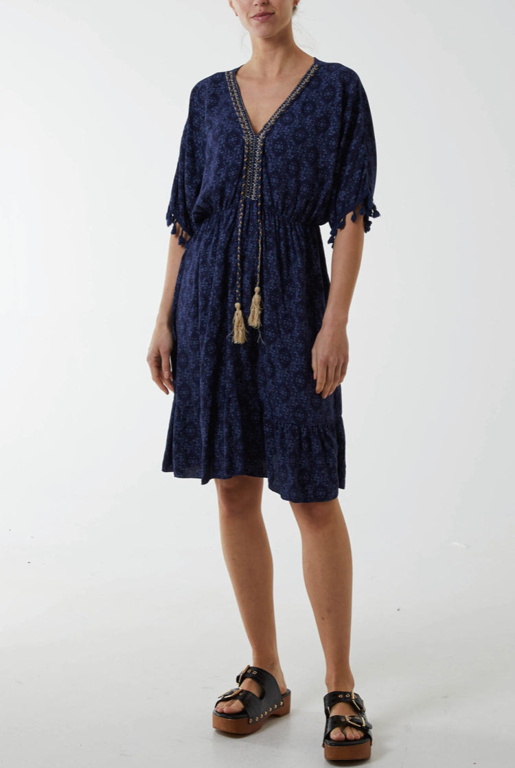 Kaftan style navy floral print mini dress with gold tassel detail 