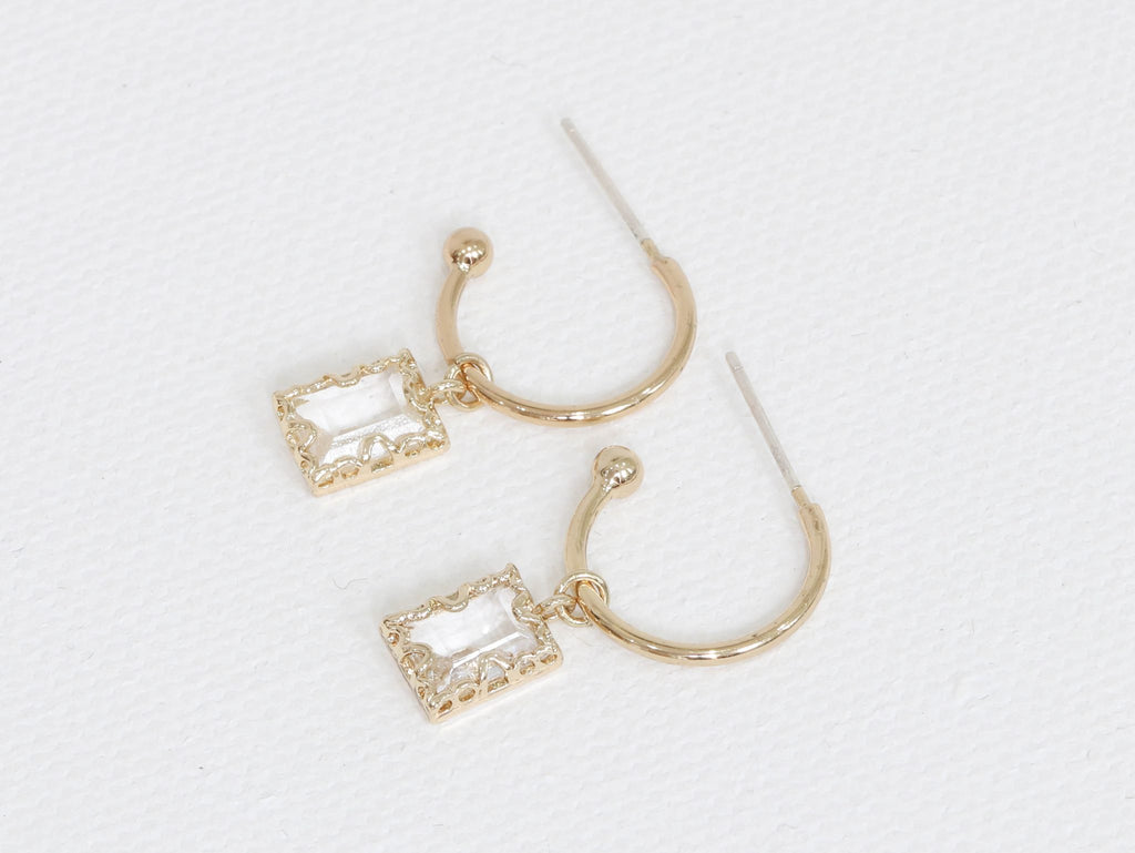 small gold hoop earrings with clear crystals