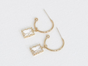 small gold hoop earrings with clear crystals