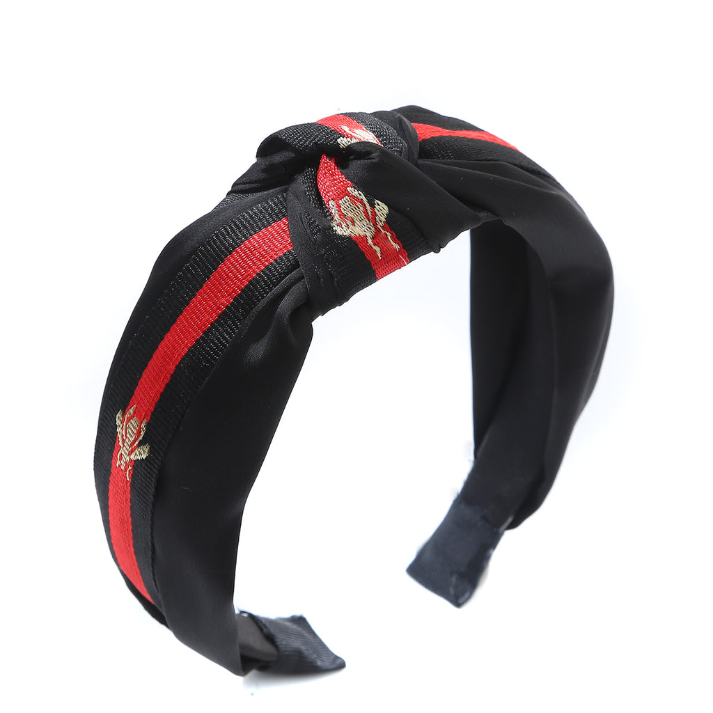 Black hairband with red stripe and gold bee detail