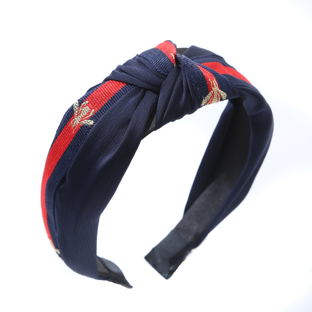 Navy hairband with red stripe and gold bee detail