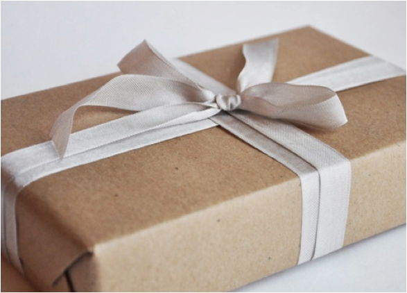 craft paper wrapped box with cream ribbon