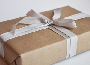 craft paper wrapped box with cream ribbon