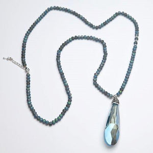 Long pendant necklace with blue beads and blue crystal teardrop