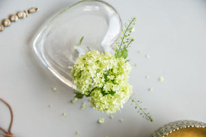 Shallow glass heart vase with small bud opening 