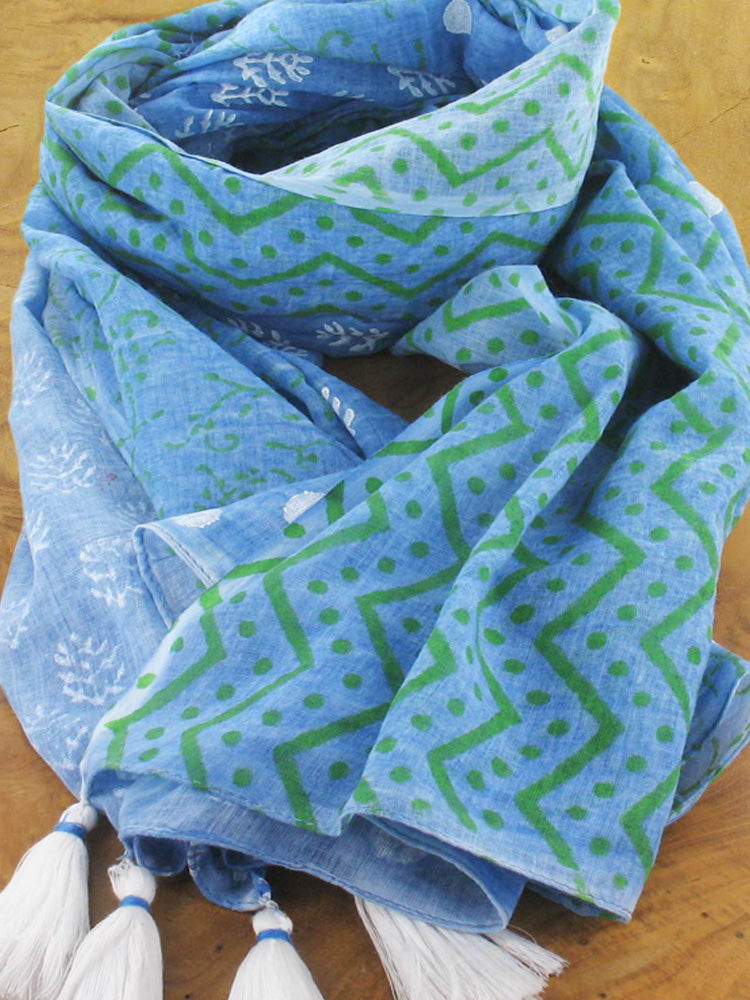 Blue cotton scarf with green zig zag and spot and white leaf design and shite tassels