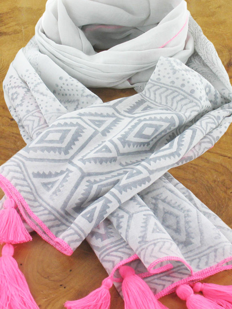 Light grey cotton scarf with dark grey aztec pattern and bright pink tassels and trim