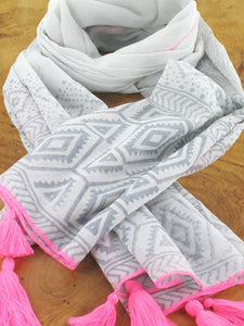 Light grey cotton scarf with dark grey aztec pattern and bright pink tassels and trim