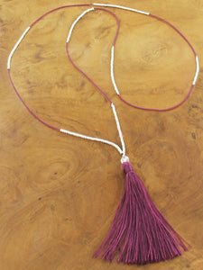 Thin long bead necklace with purple tassel