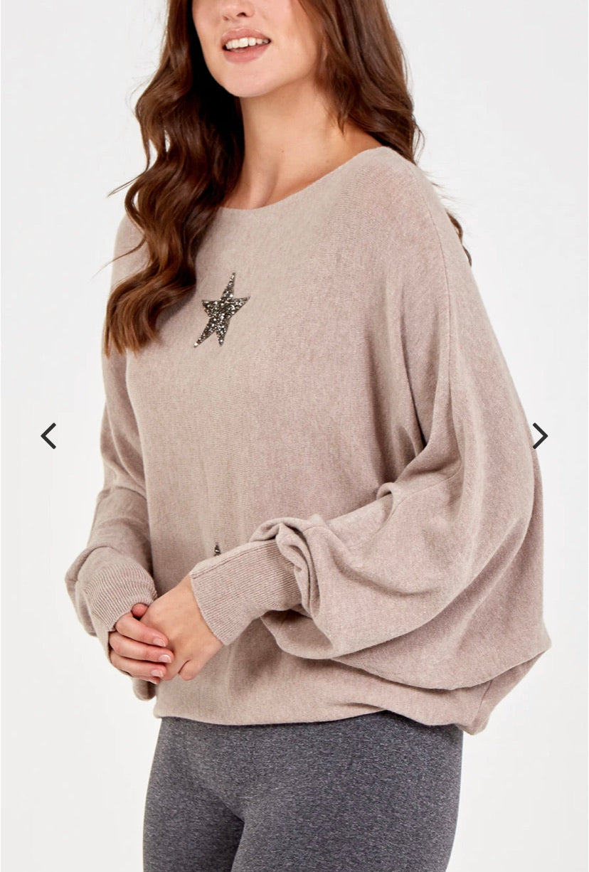 Model wearing mocha batwing jumper with two crystal stars on the front