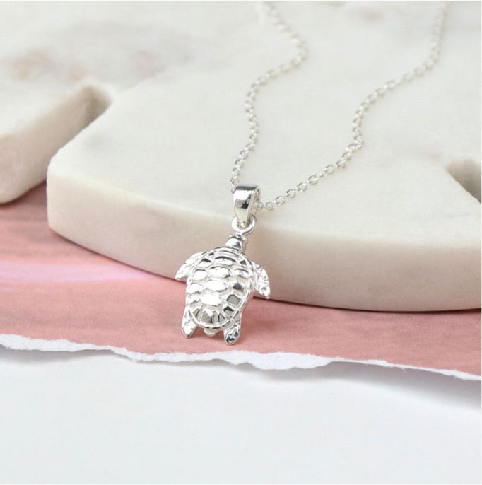 Sterling silver sea turtle charm necklace on fine silver chain