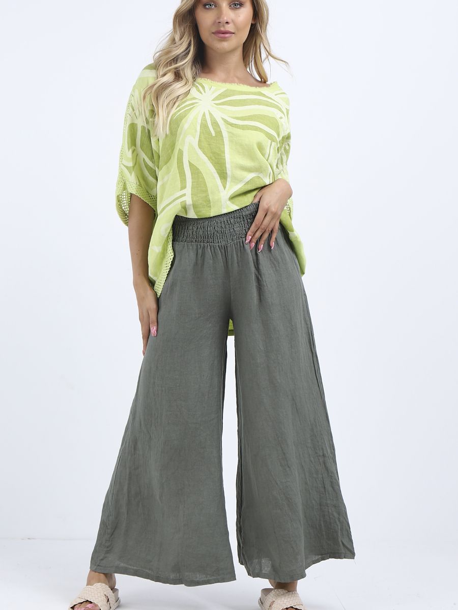 Model wearing wide leg linen palazzo trousers in khaki