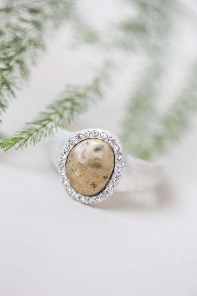 Antique silver ring with golden pebble stone surrounded by crystals